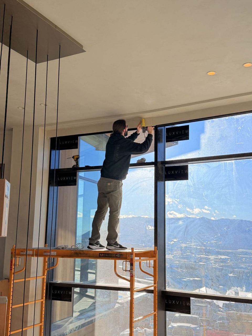 Cast showroom — floor-to-ceiling windows, architectural lighting
