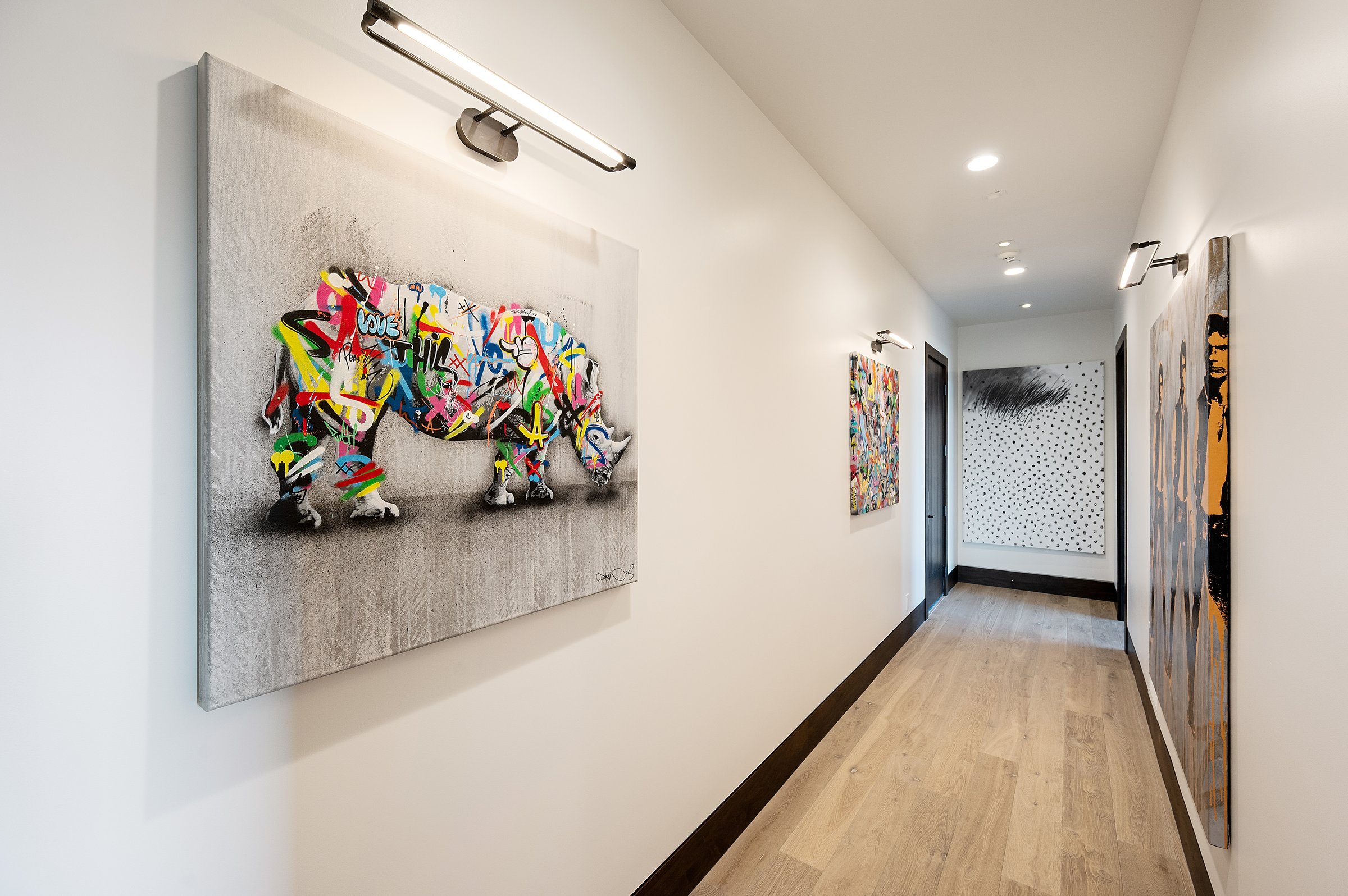 Gallery picture lights &mdash; Cast showroom hallway