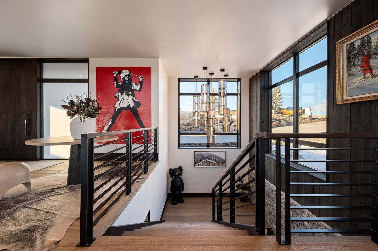 Banksy-style red figural canvas above table with Lindsey Adelman-style pendant &mdash; Park City home by Techi