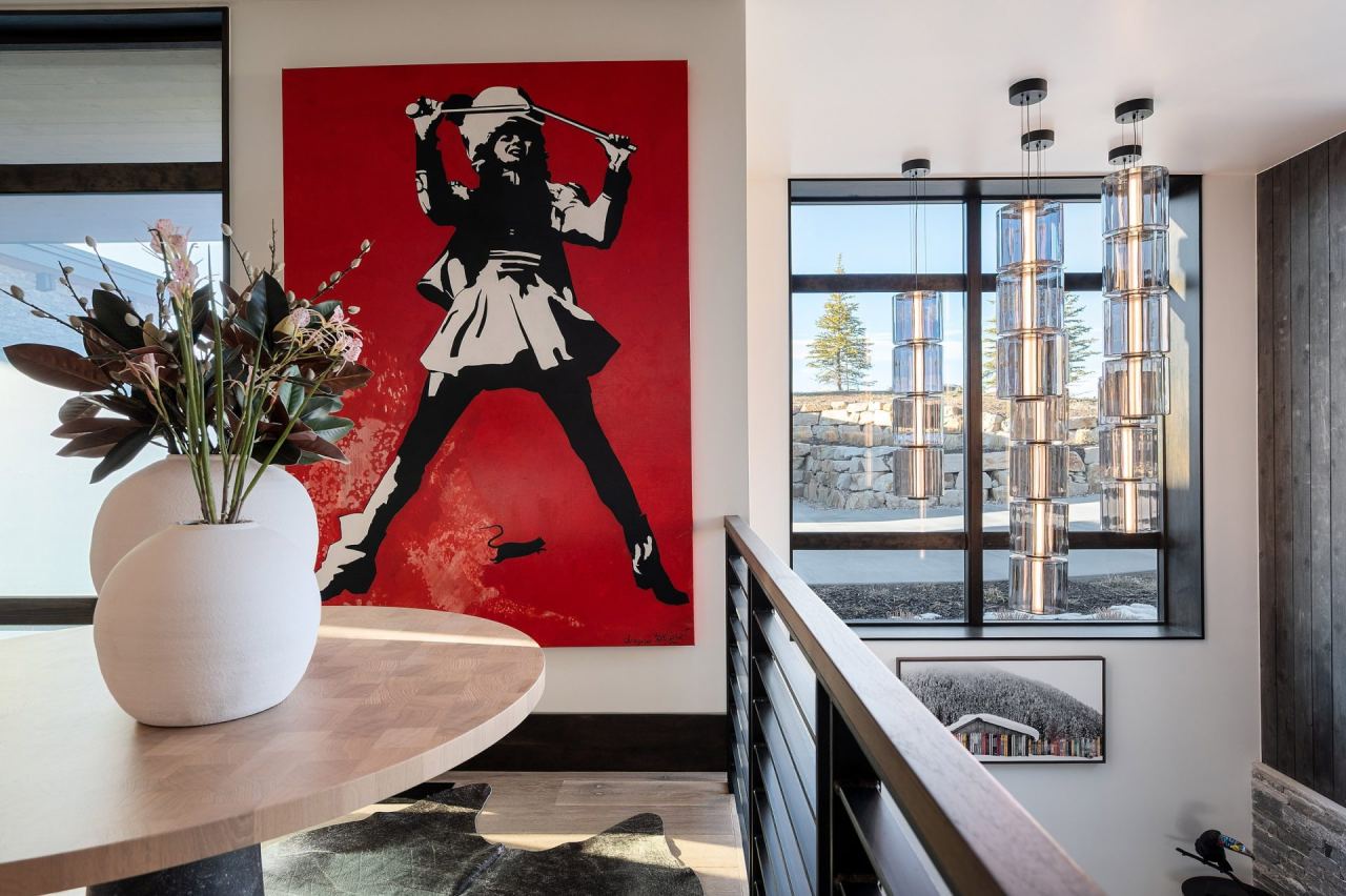 Promontory pool table room with golf-themed canvas and crystal chandelier