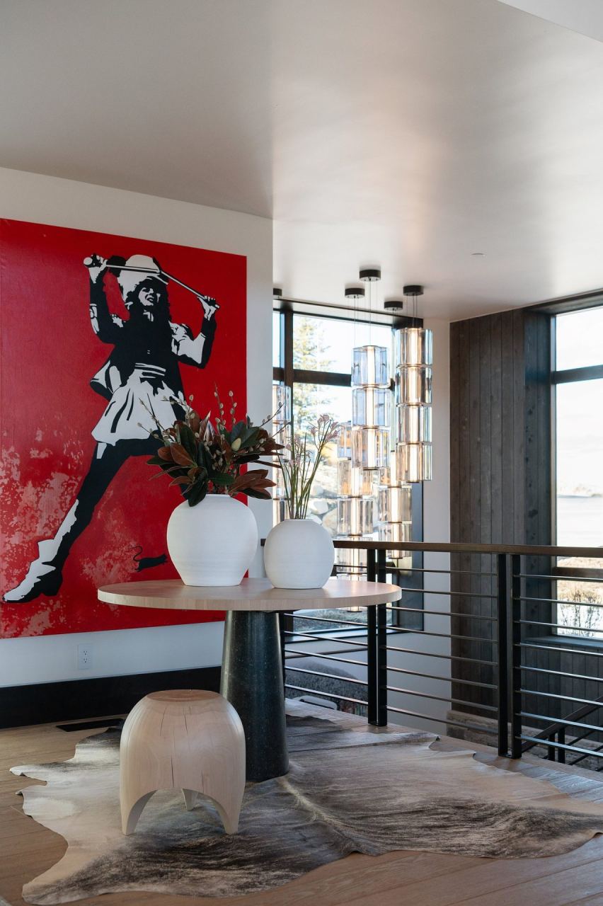 Deer Valley foyer with red figural canvas and crystal pendant chandelier