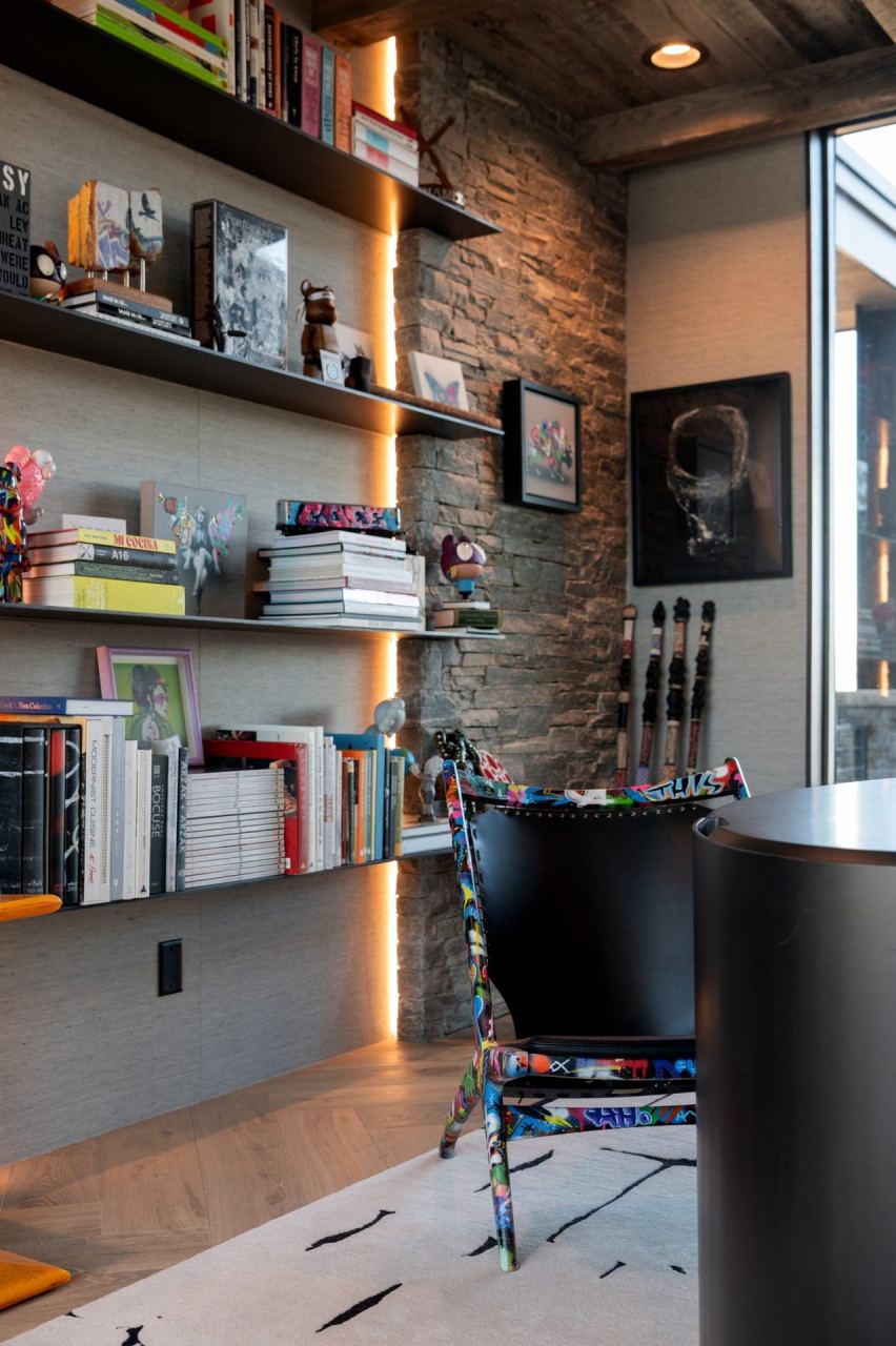 Bookshelf with graffiti-print accent chair &mdash; Wasatch Back home by Techi