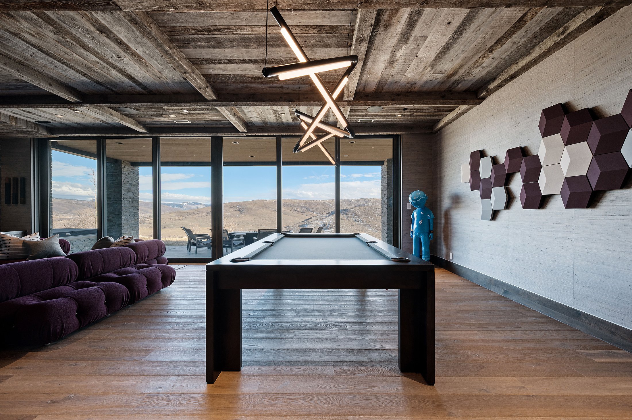 Wasatch Peaks Ranch living room with geometric LED chandelier and panoramic view