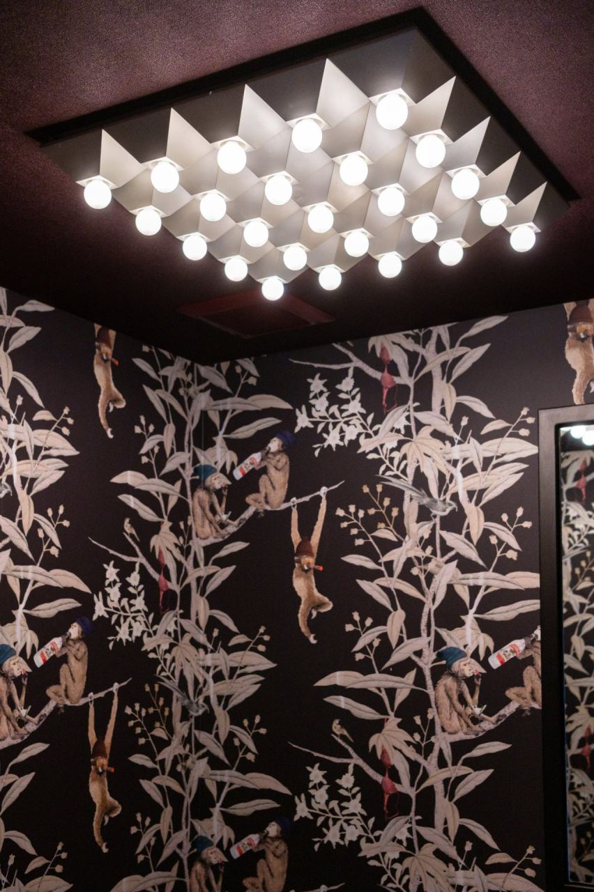 Powder room with whimsical monkey wallpaper &mdash; Park City home by Techi